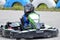 Karting - driver in helmet on kart trace