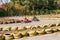 Karting. Go Kart on the track. Young positive racers in helmets driving a kart during a car race on an outdoor auto track. Extreme