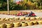 Karting. Go Kart on the track. Young positive racers in helmets driving a kart during a car race on an outdoor auto track. Extreme