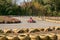 Karting. Go Kart on the track. Young positive racers in helmets driving a kart during a car race on an outdoor auto track. Extreme