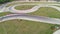 Karting race track, aerial top view in 4k video. Sport Competition. Buggy kart racing around curves.