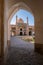 Kashan,Iran-04.08.2019: Courtyard, dome and minarets of Agha Bozorg Mosque in Kashan. Small garden in the middle of the