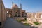 Kashan,Iran-04.08.2019: Courtyard, dome and minarets of Agha Bozorg Mosque in Kashan. Small garden in the middle of the