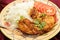 Kashmiri chicken with rice tomato and fork