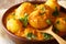 Kashmiri dum aloo: spicy potato closeup on the pan. Horizontal