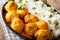 Kashmiri dum aloo: spicy potato with rice closeup on the pan. Ho