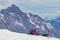 Kassbohrer PistenBully 600 snow groomer waiting at the hillside on Zugspitze mountain in the European Alps on a sunny summer day