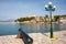 Kassiopi port in Corfu with a cannon in Greece