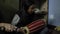 Kathmandu, Nepal - 25 November 2019: A beautiful Indian Nepalese teenage girl plays a national madala drum while sitting