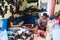 KATHMANDU, NEPAL - APRIL 2015: two shoemakers working on shoes in their workshop