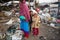 KATHMANDU, NEPAL - children and parents are working on dump.