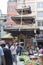 KATHMANDU, NEPAL - MAY 15, 2014: People are shopping a busy street named Ason Tole in front of the Ganesh Shrine, Indra Chowk, Kat