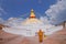 KATHMANDU, NEPAL OCTOBER 15, 2017: Close up of moks praying close the gorgeous monument Boudhanath stupa and its