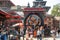 Kathmandu, Nepal - October 2019: Prayers near the statue of Kal Bhairav in Durbar Square during the Dashain Festival