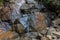 Kathu waterfall water gently flowing down the rocks Patong Phuket Thailand Asia