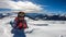 Katschberg - A woman lying in powder snow any enjoying the sun