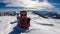 Katschberg - A woman lying in powder snow any enjoying the sun