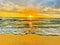 Kauai\\\'s Sunset Radiance: Golden Shore, Foamy Waves, and Turquoise Waters