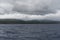 Kauai`s west coast at dusk in winter viewed from a boat, Hawaii