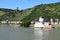 Kaub, Germany - 06 14 2021: Burg Gutenfels in the vineyards and Burg Pfalzgrafenstein on a Rhine island