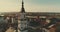 KAUNAS, LITHUANIA - APRIL 20, 2017: AERIAL. Smooth drone shot around Church of St. Francis Xavier and Town Hall above square in do