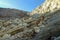 Kawah Ijen, East Java, Indonesia - May 25: Sulfur miner hiking down into the crater of Kawah Ijen volcano in East Java