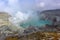 Kawah Ijen volcanic crater emitting sulphuric gas still used for sulphur mining in East Java