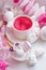 Kawaii tea cup with cutest funny eyes and unicorn eggs and sweets on festive background, cute holiday ester springtime breakfast