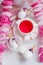 Kawaii tea party concept - scented tea in white cup, decorated unicorn eggs, trendy modern easter holiday breakfast closeup