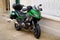 Kawasaki Versys 1000 green trail gt motorcycle parked in street city