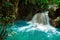 Kawasan waterfall in a mountain gorge in the tropical jungle of the Philippines, Cebu