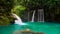 Kawasan waterfall in a mountain gorge in the tropical jungle of the Philippines, Cebu