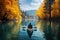kayak adventure man in a boat on peaceful lake in autumn