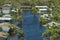 Kayak boat floating on flooded street surrounded by hurricane Ian rainfall flood waters homes in Florida residential