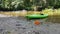 A Kayak and Disc Golf Disc on a River