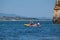 Kayak excursions to visit the caves to the cave of the tourist Praia do Camilo de Lagos in the Algarve, Portugal in the summer of