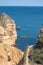 Kayak excursions to visit the caves to the cave of the tourist Praia do Camilo de Lagos in the Algarve, Portugal in the summer of