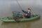 Kayak fishing. Fisherman catch pike fish on inflatable boat with fishing tackle at lake