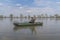 Kayak fishing. Fisherman caught pike fish on inflatable boat with fishing tackle at lake