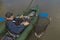 Kayak fishing. Fisherman caught pike fish on inflatable boat with fishing tackle at lake