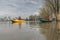 Kayak fishing at lake. Two fisherwomen on inflatable boats with fishing tackle