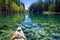 kayak floating on clear, tranquil lake