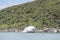 Kayak flotilla sailing at big round cliff at Breton Cave, near Kaiteriteri, Abel Tasman park,  New Zealand