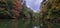 Kayak on mirror Lake state park fall colors and rocky bluff outcrops reflecting in the water