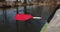 Kayak paddle water drops.Red paddle close-up