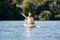 Kayak with tourists travel on the river