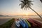 kayak under a palm tree on sand beach