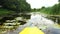 Kayak view from the nose, calm river