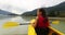 Kayak. Woman kayaking in Squamish paddling in Squamish Estuary surrounded by mountains relaxing enjoying tranquility