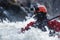 kayaker with action camera on helmet amidst rapids